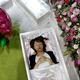 Staff member lies in a casket demonstrating Okuribito funeral’s funeral service at the Life Ending Industry Expo in Tokyo. (Reuters/Kim Kyung-Hoon )